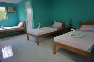 Postel nebo postele na pokoji v ubytování Lylie Hotel