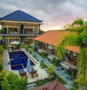 an aerial view of a house with a swimming pool at Summer Guesthouse Lovina in Lovina