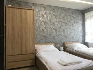 Postel nebo postele na pokoji v ubytování Kristály apartmanok