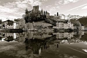 a black and white photo of a castle on a hill at Seeapart Pöder in Ladis