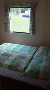 En eller flere senge i et værelse på Rybnik Dalibor