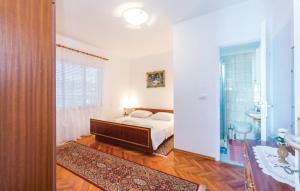 Postel nebo postele na pokoji v ubytování Apartmani "PALMA"