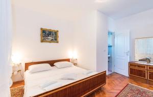 Postel nebo postele na pokoji v ubytování Apartmani "PALMA"