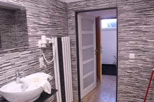 Kopalnica v nastanitvi Apartmány Ztracená