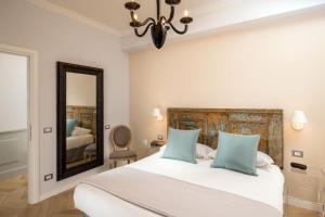 Letto o letti in una camera di Borgo Pio Charme