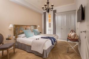 Letto o letti in una camera di Borgo Pio Charme