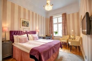 Postel nebo postele na pokoji v ubytování Hotel Kung Carl, WorldHotels Crafted