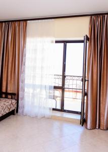 Postel nebo postele na pokoji v ubytování Hotel Olimp