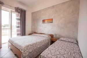 Postel nebo postele na pokoji v ubytování B&B "Posta di Colonna"