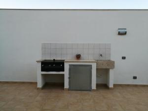 a kitchen with a stove and a counter top at Alykès in Marsala