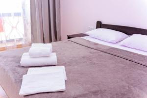 Postel nebo postele na pokoji v ubytování Hotel Olimp