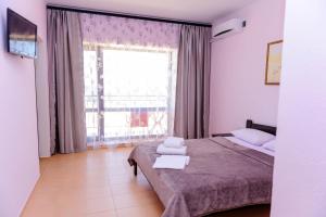 Postel nebo postele na pokoji v ubytování Hotel Olimp + 11 fotografií