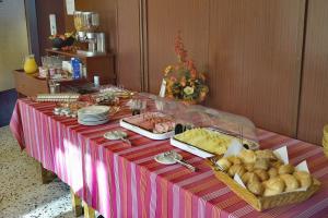 a table with a buffet of food on it at Frühstückspension Matheidl in Ferlach