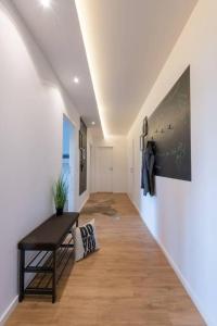 a hallway of a house with a table and a wall at Exklusive Design Erlebnisferienwohnung in Bad Wörishofen