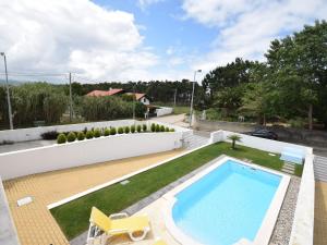 a swimming pool in the backyard of a house at Modern Villa in S o Martinho do Porto with Swimming Pool in São Martinho do Porto