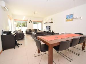 an office with a conference room with a table and chairs at Modern Villa in S o Martinho do Porto with Swimming Pool in São Martinho do Porto