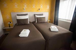 Een bed of bedden in een kamer bij Hotel Slapen in Veghel