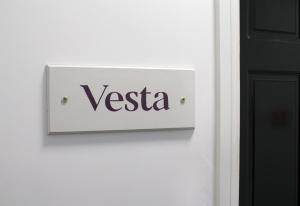 a sign on a door with the word versa at Vesta Central Bath Apartment in Bath