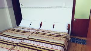 Postelja oz. postelje v sobi nastanitve Phat Dat Hotel