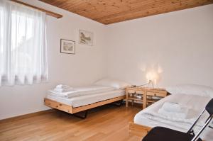 Postel nebo postele na pokoji v ubytování Apartment Aare 3.5 by GriwaRent AG