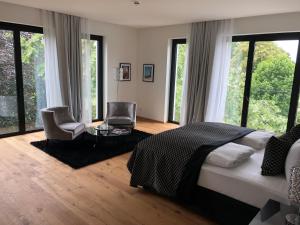 Postel nebo postele na pokoji v ubytování Voss Villa