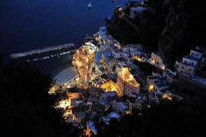 an aerial view of a city at night at Palazzo Ferraioli - Hotel & Wellness in Atrani