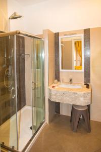 a bathroom with a sink and a shower at YourHome - Casa Aristide in Sant'Agnello