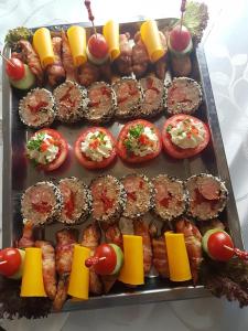 a tray of food with appetizers and other foods at VILA Corviniana in Hunedoara