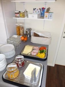 a kitchen counter with two trays of food on it at Visby Innerstad Lägenheter & Rum in Visby