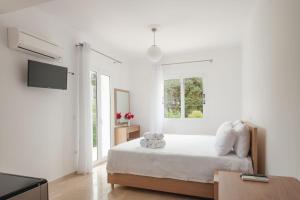 Cama ou camas em um quarto em Studios Angeliki