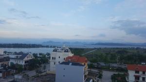 an aerial view of a building with a lake in the background at Sky in Ha Long +21 photos