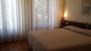 Cama ou camas em um quarto em Hotel Belvedere