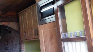 Kuchyň nebo kuchyňský kout v ubytování Vivienda Vacacional El Navariegu 1