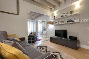 Televízia a/alebo spoločenská miestnosť v ubytovaní De Rustici Apartment