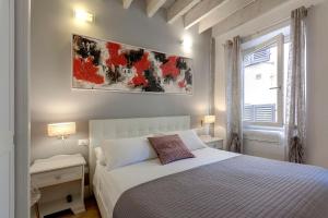 Posteľ alebo postele v izbe v ubytovaní De Rustici Apartment