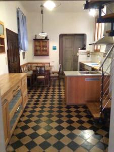 a kitchen with a black and white checkered floor at Palais-Volkach in Volkach
