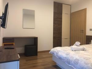 Postel nebo postele na pokoji v ubytování Apartmani Izvor - Tuheljske Toplice