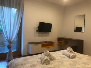 Postel nebo postele na pokoji v ubytování Apartmani Izvor - Tuheljske Toplice + 33 fotografií