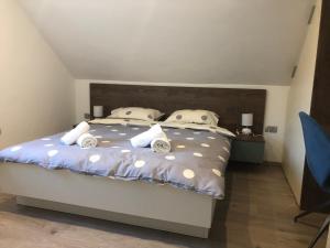 Postel nebo postele na pokoji v ubytování Apartmani Izvor - Tuheljske Toplice