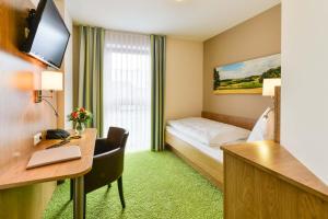 TV a/nebo společenská místnost v ubytování Hotel Sixt