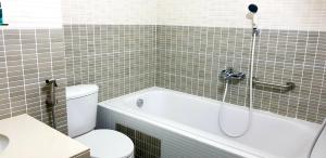 a bathroom with a tub and a toilet and a sink at Finimas Residence in Thimarafushi +172 photos