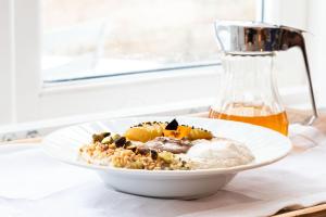 a bowl of food on a table with a drink at Trevose Harbour House in St Ives