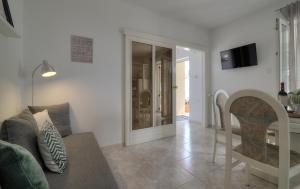 a living room with a couch and a table at Apartment Barbara in Senj