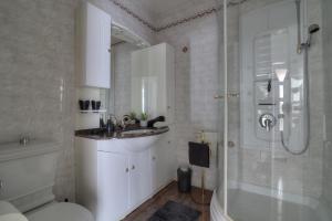 a bathroom with a toilet and a sink and a shower at Apartment Barbara in Senj +50 photos