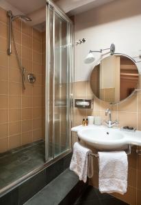 a bathroom with a sink and a shower at Buonanotte Garibaldi in Rome