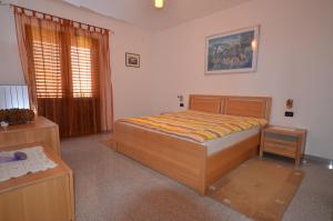 Postel nebo postele na pokoji v ubytování Apartments Ana Wellness + 37 fotografií