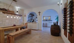 a wine tasting room with a wooden table and a wine barrel at Apartment Barbara in Senj