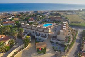 an aerial view of a house with a swimming pool at Riva Sea Apartments in Castellammare del Golfo