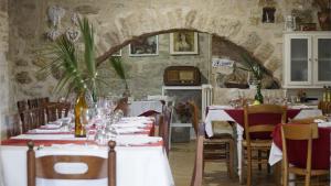 a dining room with tables and chairs in a room at Agriturismo Sorgente di Luna in Larino