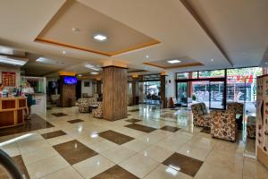 a lobby with a checkered floor in a store at Kamchia Park Hotel - All Inclusive in Golden Sands